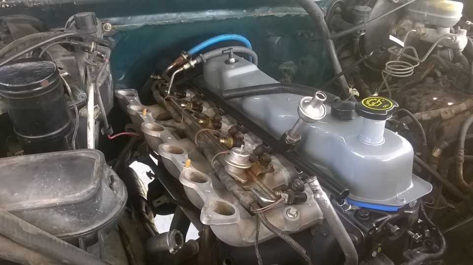 1996 Ford F-150 engine bay with fuel injectors and intake manifold visible