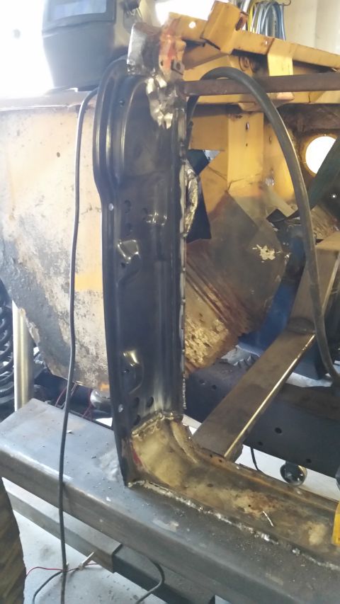 1979 Ford Bronco - A close-up view shows a partially completed metal repair on the lower section of a vehicle's body, likely a door frame or rocker panel, wit…