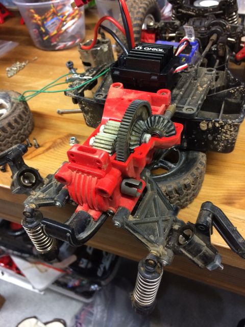 1989 Ford Bronco - This is a close-up, overhead view of the internal drivetrain and suspension components of an RC car, likely undergoing maintenance or modif…