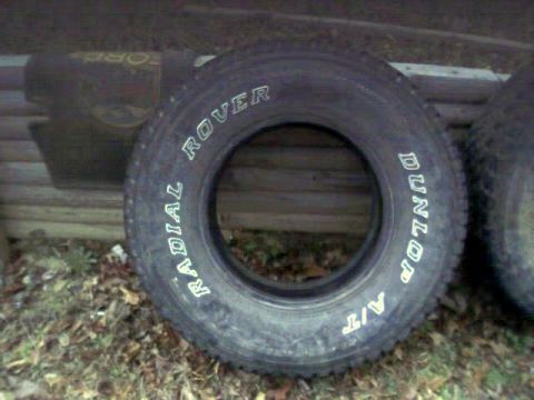 1986 Ford Bronco - A close-up view of a tire with brand and model information visible on its sidewall.