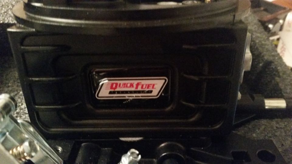 Black Quick Fuel carburetor with logo