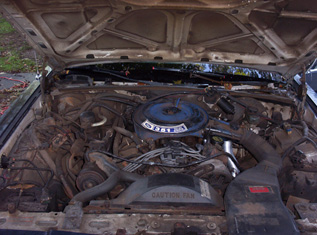 1991 Ford Crown Victoria LTD - The engine bay of a Ford Crown Victoria is shown with the hood open. The engine appears to be a V8.