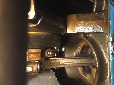 1989 Ford Bronco - Close-up view of internal engine components, including the crankshaft and connecting rod, with visible lubrication.