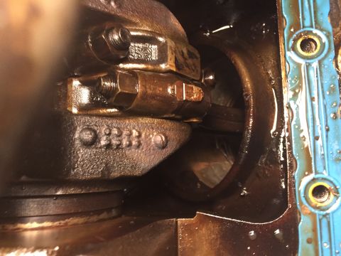 1989 Ford Bronco - This image shows the internal components of an engine, specifically the crankshaft and connecting rod bearings, with visible casting number…