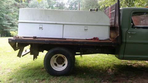 1978 Ford Bronco - Flatbed truck with a large toolbox mounted on the bed, seen from the side.