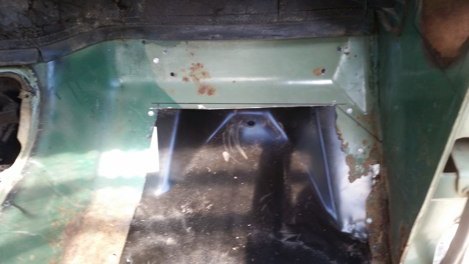 Interior floor panel with cut-out and rust spots