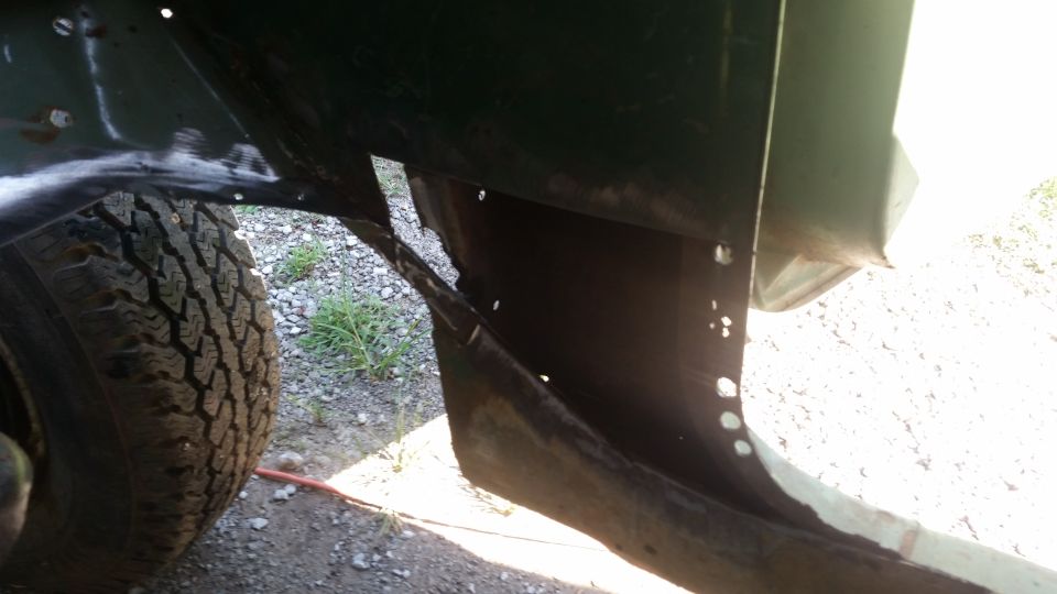 close-up of a vehicle's wheel well and tire