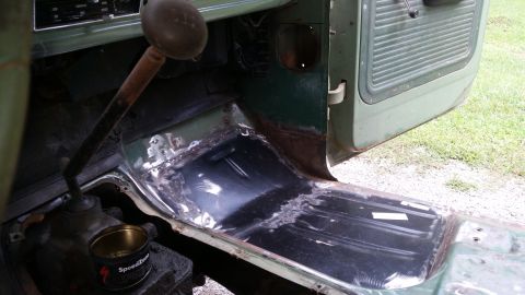1978 Ford Bronco interior floor with shifter and door open