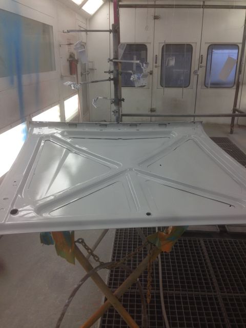 1964 Ford Fairlane - Car hood interior undergoing preparation in a paint booth.