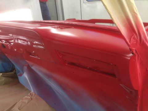 1964 Ford Fairlane - Dashboard of a 1964 Ford Fairlane undergoing a fresh coat of red paint in a spray booth.