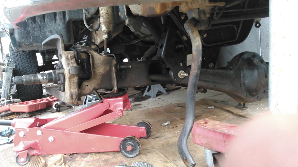 got the old brackets removed. installed the 6 inch beam drop brackets installed and the axle beams hung with new Energy Suspension poly bushings. i replaced all 3 axleshaft u-joints with Spicer 760X. replaced the balljoints with Ingalls Chassis.