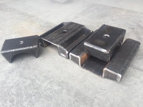 1979 Ford Bronco - These metal blocks are designed to raise a vehicle's suspension height.