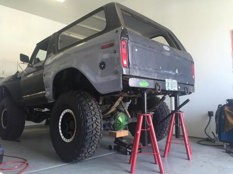 1979 Ford Bronco - 1979 Ford Bronco rear suspension work in progress, lifted on jack stands.