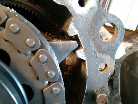 1992 Ford Bronco - Transfer case chain and gears shown in detail. The casing is partially visible in the foreground and right side.