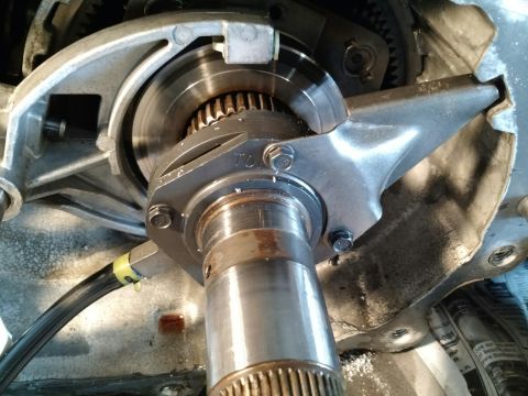 1992 Ford Bronco - Close-up view of a transfer case component with visible gears and a hose.