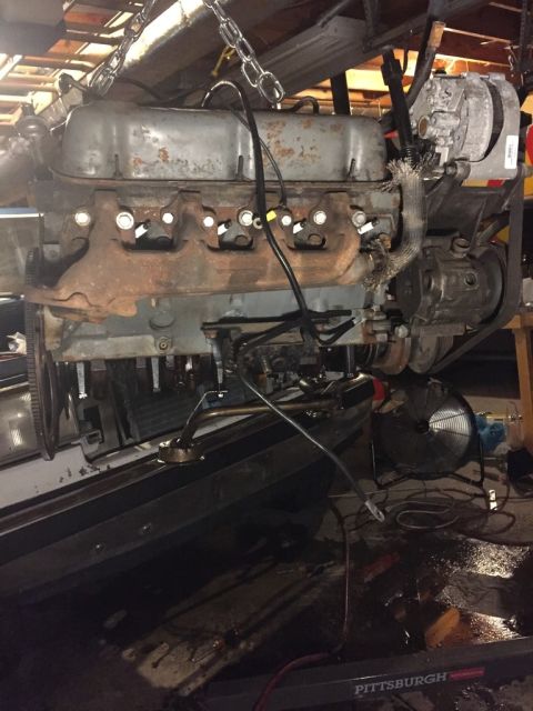 1989 Ford Bronco - the passenger side of the old engine. in the background you can see all the oil/antifreeze that spilled out while i was pulling it. what a…
