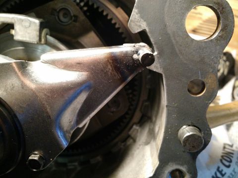 1992 Ford Bronco - Detail of a vehicle's transfer case linkage, showing mechanical components and gears.