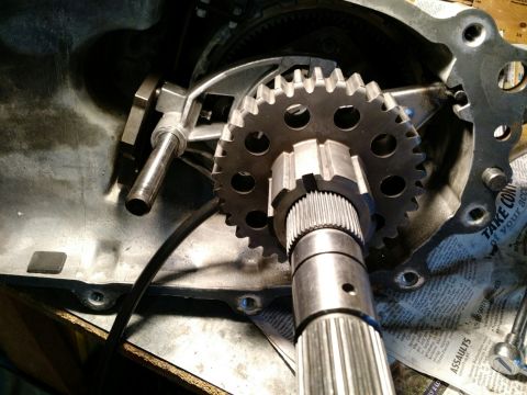 1992 Ford Bronco - Close-up view of transfer case gears and shaft, with a Supermotors logo visible at the bottom right.