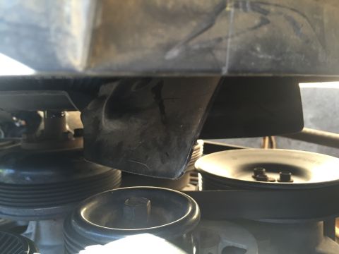 1994 Ford Bronco - Close-up view of engine pulleys and fan shroud.