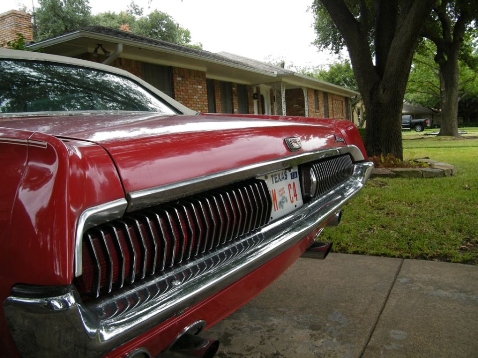 Red 1968 Mercury Cougar's rear grille and taillights, with a Texas license plate