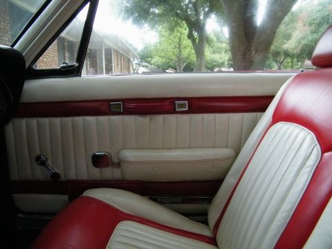 1968 Mercury Cougar - Interior view of a 1968 Mercury Cougar, highlighting the two-tone door panel and seat upholstery.