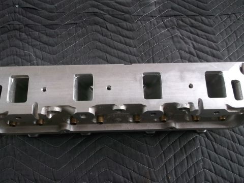 1971 Ford Ranchero - Close-up of an engine cylinder head, showing its metallic construction and port openings.