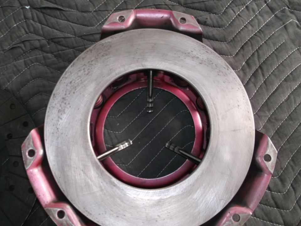 clutch pressure plate on black quilted mat