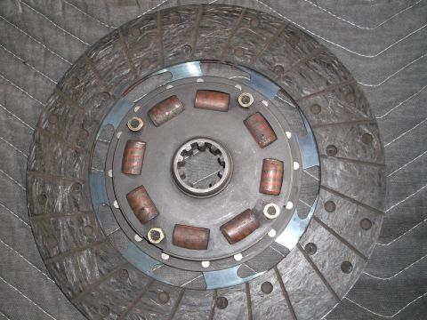 1971 Ford Ranchero - A close-up view of a clutch disc, showing its friction material and central splined hub.