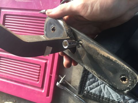 1994 Ford Bronco - Once you have the side mirror removed, this is the first screw for disassembly. It is a small T10 Torx that holds the plastic body seal ont…