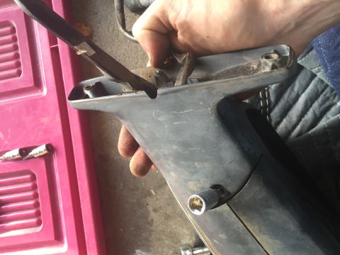 1994 Ford Bronco - Next are two T25 Torx that hold the metal bracket onto the plastic housing. The screw next to my thumb is kind of a pain with my socket set…