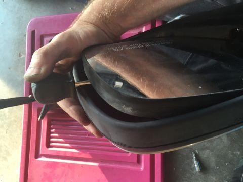 1994 Ford Bronco - Now for the fun part! I used a stubby flat head screwdriver to put pressure on the outside edge of the mirror, raising it up. Raise it up j…