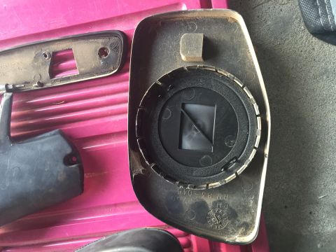 1994 Ford Bronco - Mirror removed. Notice the foam seal that keeps moisture out of the motors. Also, there are two metal tabs that go over a plastic support b…