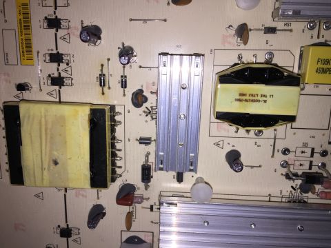 1989 Ford Bronco - This electronic circuit board features several components, including transformers and capacitors, with visible text markings.