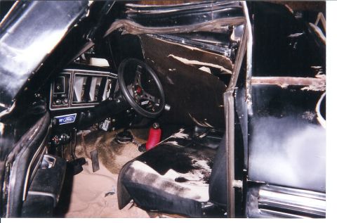 1978 Ford Bronco - Interior view of a 1978 Ford Bronco, showing custom steering wheel and shifter.