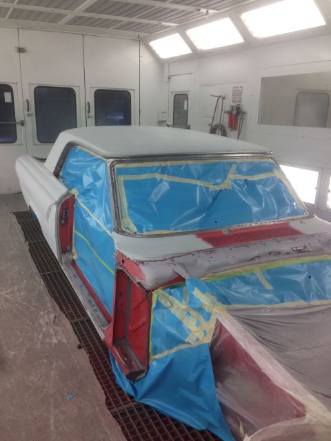 1964 Ford Fairlane - Car body is masked and prepped for paint in a professional spray booth.