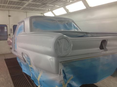 1964 Ford Fairlane - A 1964 Ford Fairlane is prepped for painting inside a professional booth.
