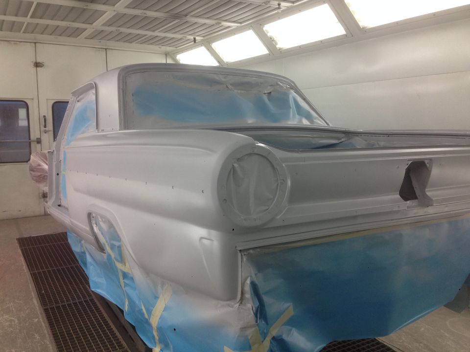 1964 Ford Fairlane in paint booth, primer gray, 3q-front view