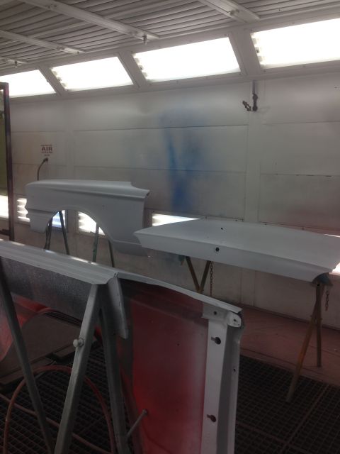 1964 Ford Fairlane - Car parts are prepared for painting inside a booth.