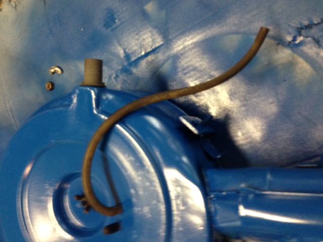 Blue painted air cleaner housing with a brown hose attached