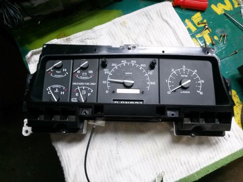 1996 Ford Bronco - Instrument cluster speedometer, tachometer, fuel, and oil gauges, with "UNLEADED FUEL ONLY" text visible.