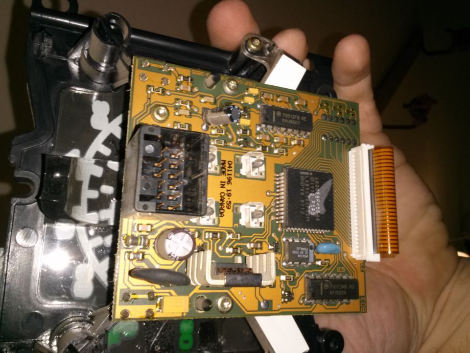 Circuit board with connectors and chips, held in hand