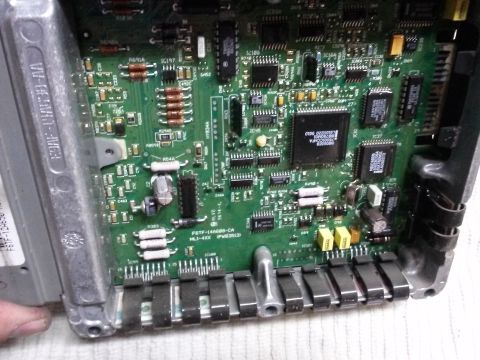 1996 Ford Bronco - This is a close-up view of an engine control unit's internal circuitry, showing various electronic components.