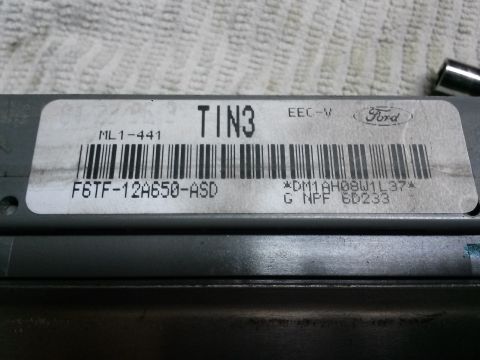 1996 Ford Bronco - Close-up of a Ford EEC-V engine control module, identified by its part number and barcode.