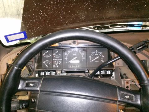 1996 Ford Bronco - Interior view of a vehicle's dashboard, showing the steering wheel and instrument cluster with various gauges.