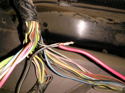 1996 Ford Bronco - Exposed wires in a vehicle's electrical system, possibly indicating a wiring issue.