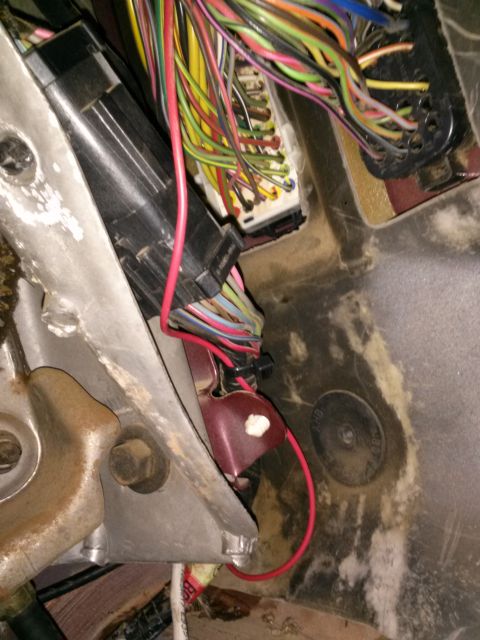 1996 Ford Bronco - Interior view of a vehicle's complex wiring harness and fuse box, showing numerous colorful wires.