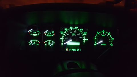 1996 Ford Bronco - Interior view of a 1996 Ford Bronco's illuminated dashboard gauges, showing the speedometer at 0 MPH.