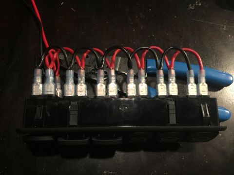 1996 Ford Bronco - This image shows a wiring harness connected to an accessory switch panel, likely for adding aftermarket electronics.