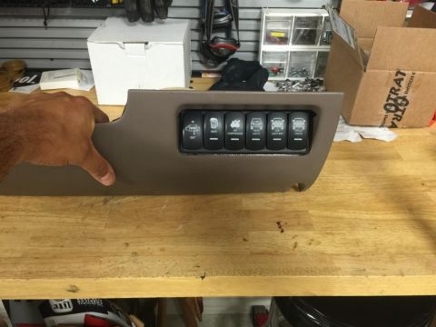 1996 Ford Bronco - This interior panel features six rocker switches, including controls for air compressor and lights, suggesting aftermarket customization.
