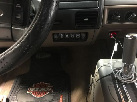 1996 Ford Bronco - Interior view of a 1996 Ford Bronco, aftermarket rocker switches on the dashboard.